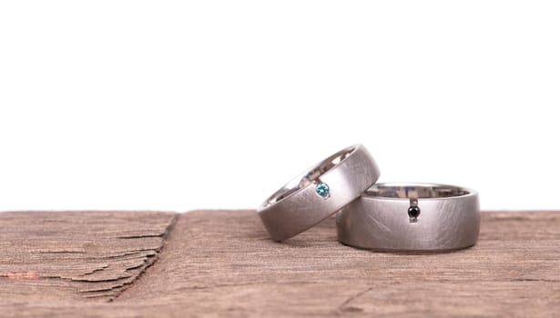 Wedding rings isolated on old wood, selective focus