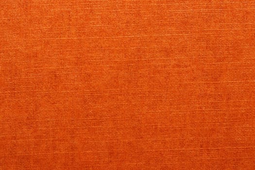 Orange texture. Closeup of a bright seamless orange paper or carton detail texture background for design and text. Macro.
