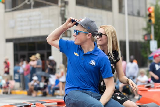 Indianapolis, Indiana, USA - May 26, 2018, Indycar driver Spencer Pigot on a car going down the road at the Indy 500 Parade