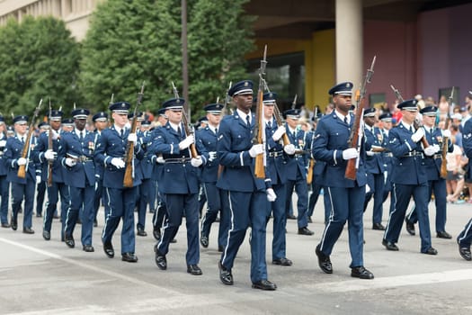 Indianapolis, Indiana, USA - May 26, 2018, Members of the US Air Force march in formation with rifles down the road at the Indy 500 Parade