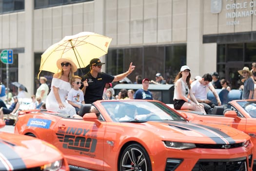 Indianapolis, Indiana, USA - May 26, 2018, Indycar driver Ryan Hunter - Reay and his family, on a car going down the road at the Indy 500 Parade