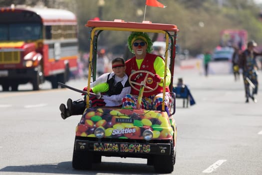 Washington, D.C., USA - April 14, 2018 Clowns going down the street in the 2018 National Cherry Blossom Parade