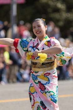 Washington, D.C., USA - April 14, 2018 Japanese women wearing kimonos and dancing in the 2018 National Cherry Blossom Parade
