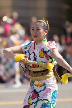 Washington, D.C., USA - April 14, 2018 Japanese women wearing kimonos and dancing in the 2018 National Cherry Blossom Parade