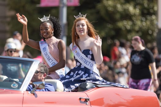 Washington, D.C., USA - April 14, 2018 Miss District of Columbia Teen going down the road in the 2018 National Cherry Blossom Parade