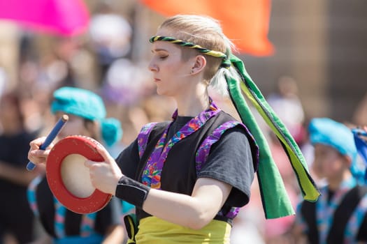 Washington, D.C., USA - April 14, 2018 Okinawan Taiko Drummers of Wisconsin playing traditional Okinawan music in the 2018 National Cherry Blossom Parade