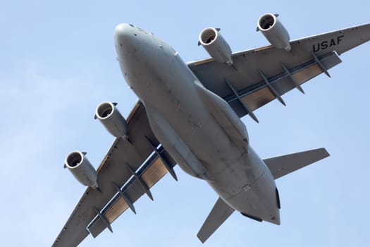 Louisville, Kentucky, USA - April 21, 2018 C-17 Globemaster cargo plane flying by at the Thunder Over Louisville