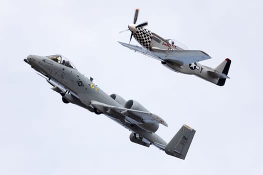 Louisville, Kentucky, USA - April 21, 2018 A-10 Thunderbolt and a P-51 Mustang in formation at the Thunder Over Louisville