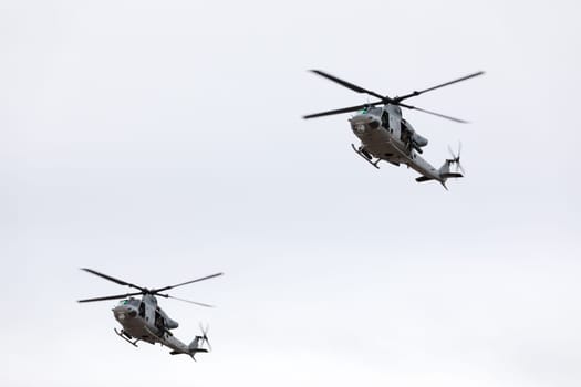 Louisville, Kentucky, USA - April 21, 2018 UH-1 Iroquois transport helicopters in formation fly by at the Thunder Over Louisville