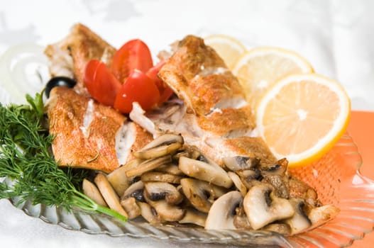 Sea bass fillet with mushrooms, lemon and greens