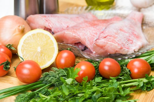 Fresh sea bass fillet, sliced and clean for further preparation