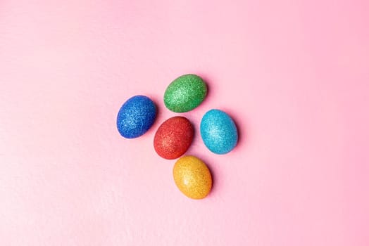 Colorful easter eggs on pink color background. Happy Easter