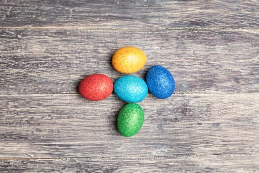 Colorful easter eggs on wooden table. Happy Easter