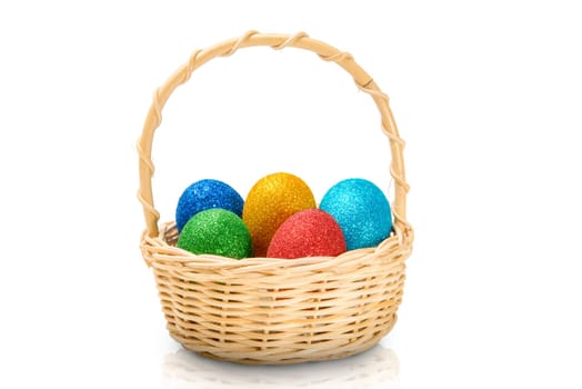 Colorful easter eggs with glitter on wooden basket isolated over white background. Happy Easter