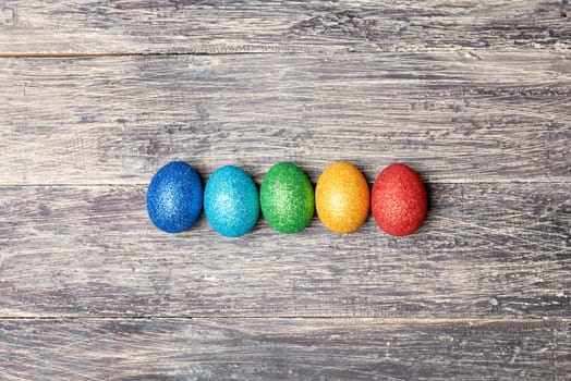 Colorful easter eggs on wooden table. Happy Easter