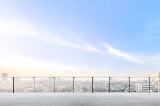 Empty modern terrace area with city view over blue sky background
