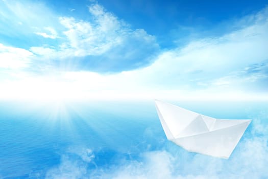 White paper boat sailing on blue ocean with blue sky and sunlight background