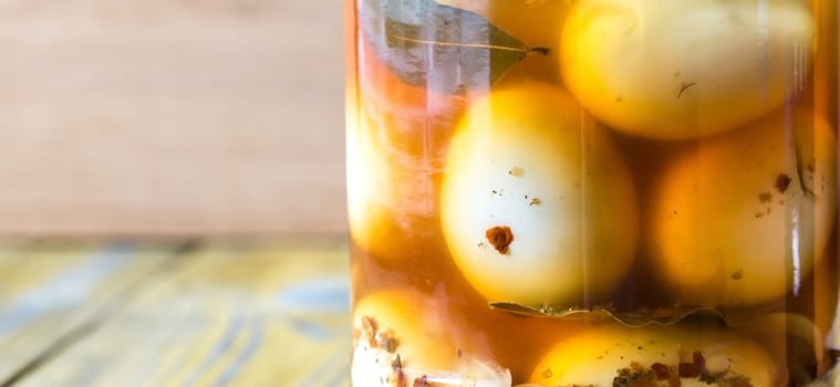 Pickled eggs in the glass jar