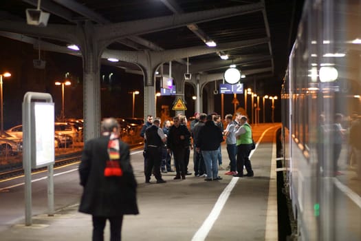 Bad Kreuznach, Germany - November 03, 2018: Police question a group of rioters at a platform in the night of November 03, 2018 in Bad Kreuznach..