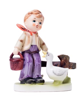 Very old statue, small ceramic boy with a goose, isolated on white