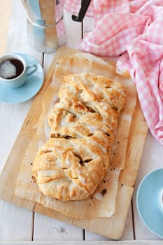 Delicious puff pastry with apple raisin filling and sugar frosting