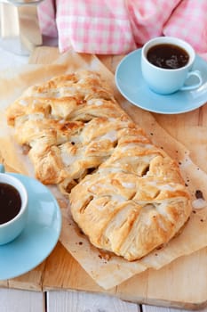 Delicious puff pastry with apple raisin filling and sugar frosting