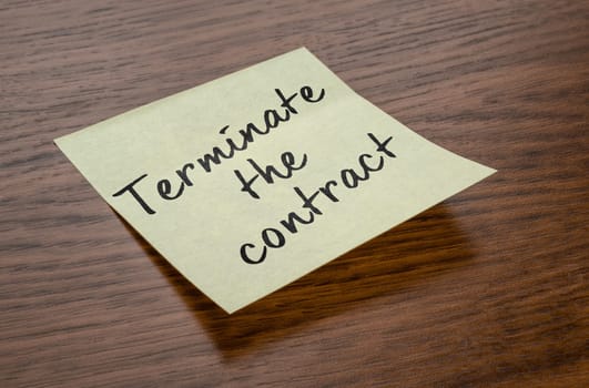 Sticky note with the text Terminate the contract