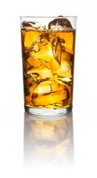A glass with iced tea and icecubes on a white background