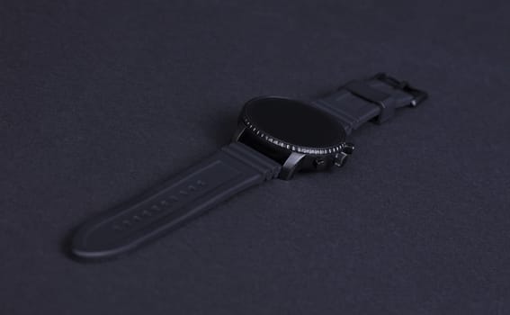 Black smartwatch isolated on a black background