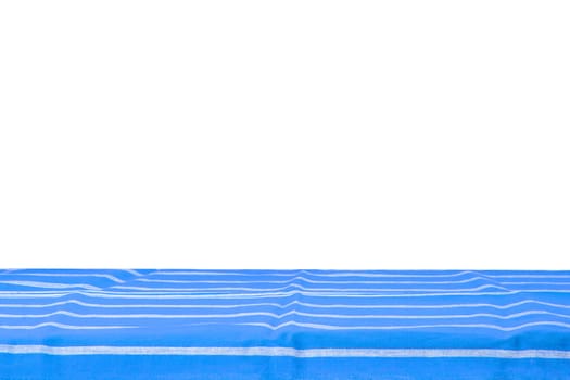 Empty wooden table isolated. Empty wooden deck table with blue striped tablecloth isolated on a white background. Template for your food and product display montage.