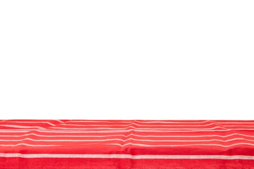 Empty wooden table isolated. Empty wooden deck table with red striped tablecloth isolated on a white background. Template for your food and product display montage.