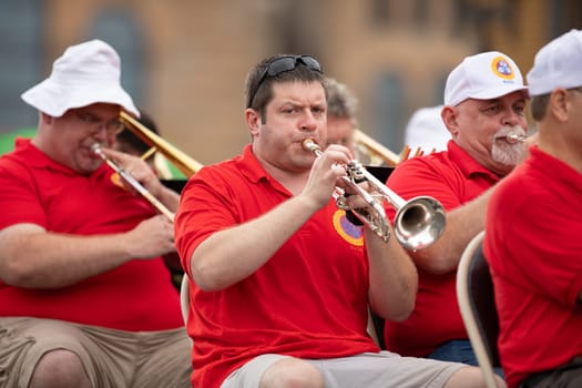 Peru, Indiana, USA - July 21, 2018 The Circus Festival Band playing under the rain at the Circus City Festival Parade