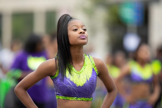 Indianapolis, Indiana, USA - September 22, 2018: The Circle City Classic Parade, African american cheerleader dancing during the parade