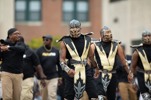 Indianapolis, Indiana, USA - September 22, 2018: The Circle City Classic Parade, Members of the Alpha Phi Alpha Fraternity INC dress up as Scorpion from mortal kombat at the parade