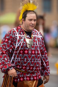 Peru, Indiana, USA - July 21, 2018 Man wearing a native american outfit at the Circus City Festival Parade