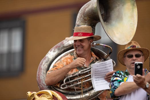 Peru, Indiana, USA - July 21, 2018 Man playing the Sousaphone on top of a float at the Circus City Festival Parade