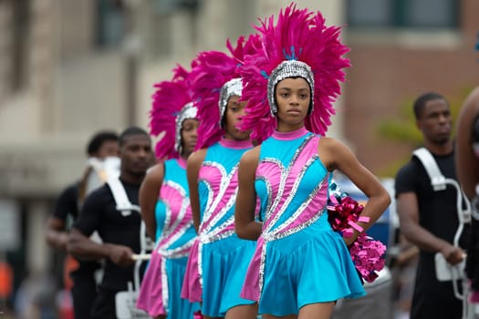 Indianapolis, Indiana, USA - September 22, 2018: The Circle City Classic Parade, Members of the Elite Striders drill tream dancing during the parade