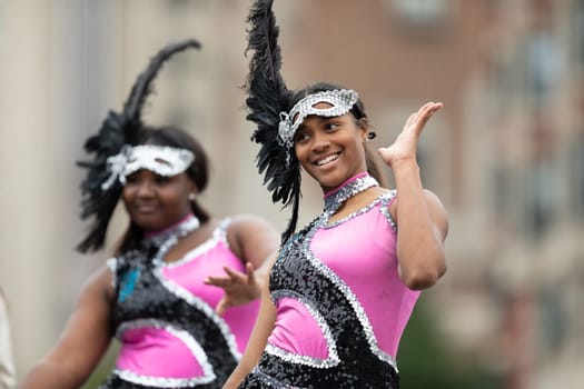 Indianapolis, Indiana, USA - September 22, 2018: The Circle City Classic Parade, Members of the Elite Striders drill tream dancing during the parade