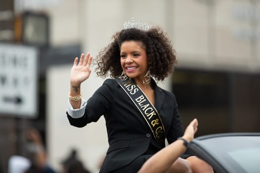 Indianapolis, Indiana, USA - September 22, 2018: The Circle City Classic Parade, African American beauty queen from the distric of Indiana Miss Black and Gold