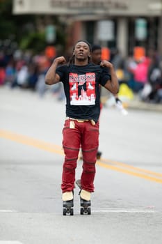 Indianapolis, Indiana, USA - September 22, 2018: The Circle City Classic Parade, African american man on roller skates dancing during the parade