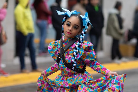 Matamoros, Tamaulipas, Mexico - November 20, 2018: The November 20 Parade, Young girl wearing traditional clothing dancing at the parade