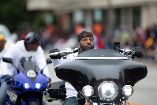 Indianapolis, Indiana, USA - September 22, 2018: The Circle City Classic Parade, African American Members of the 317 Ryders, riding motorcycles down the road at the parade