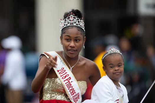 Indianapolis, Indiana, USA - September 22, 2018: The Circle City Classic Parade, African American Beauty Queem riding a car going down the road  during the parade
