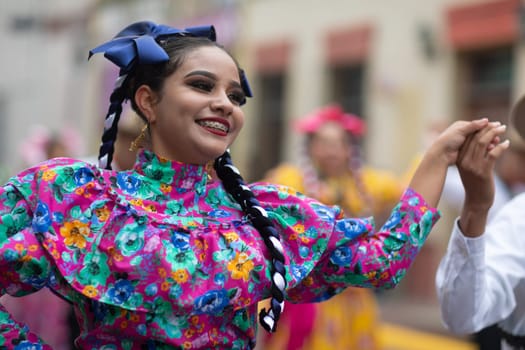 Matamoros, Tamaulipas, Mexico - November 20, 2018: The November 20 Parade, Young women and men dancing wearing traditional mexican clothing during the parade