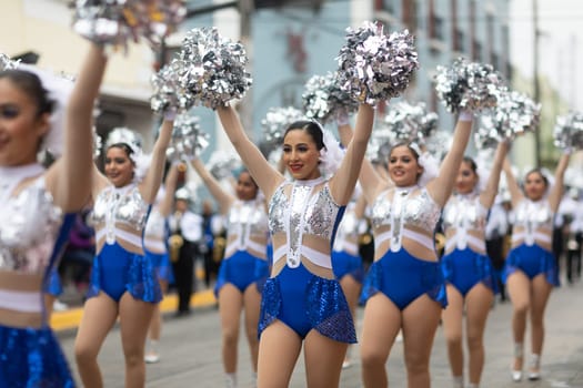 Matamoros, Tamaulipas, Mexico - November 20, 2018: The November 20 Parade, Mexican Cheerleaders dancing during the parade