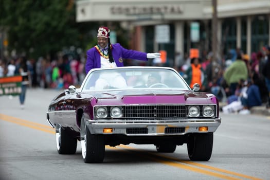 Indianapolis, Indiana, USA - September 22, 2018: The Circle City Classic Parade, Purple classic Donk Chevrolet car going down the road at the parade