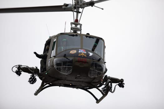 Peru, Indiana, USA - July 21, 2018 Military Helicopter makes a fly by at the Circus City Festival Parade
