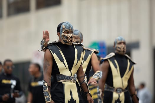 Indianapolis, Indiana, USA - September 22, 2018: The Circle City Classic Parade, Members of the Alpha Phi Alpha Fraternity INC dress up as Scorpion from mortal kombat at the parade