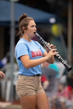 Peru, Indiana, USA - July 21, 2018 Members of the Maconaquah Marching Braves marching band perform at the Circus City Festival Parade
