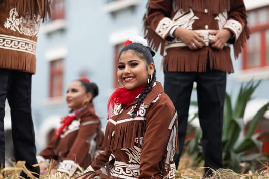 Matamoros, Tamaulipas, Mexico - November 20, 2018: The November 20 Parade, Young Mexican woman wearing traditional mexican clothing going down the road during the parade